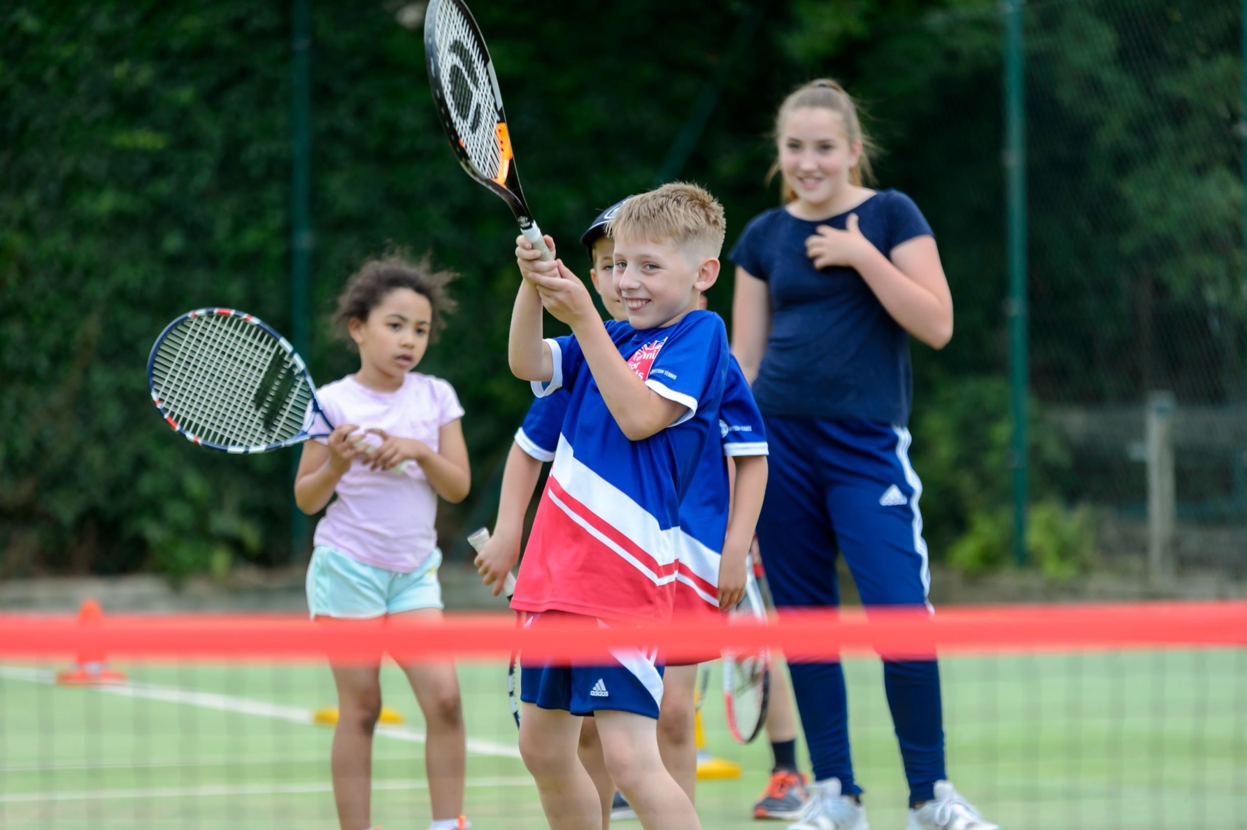 Image of children playing tennis